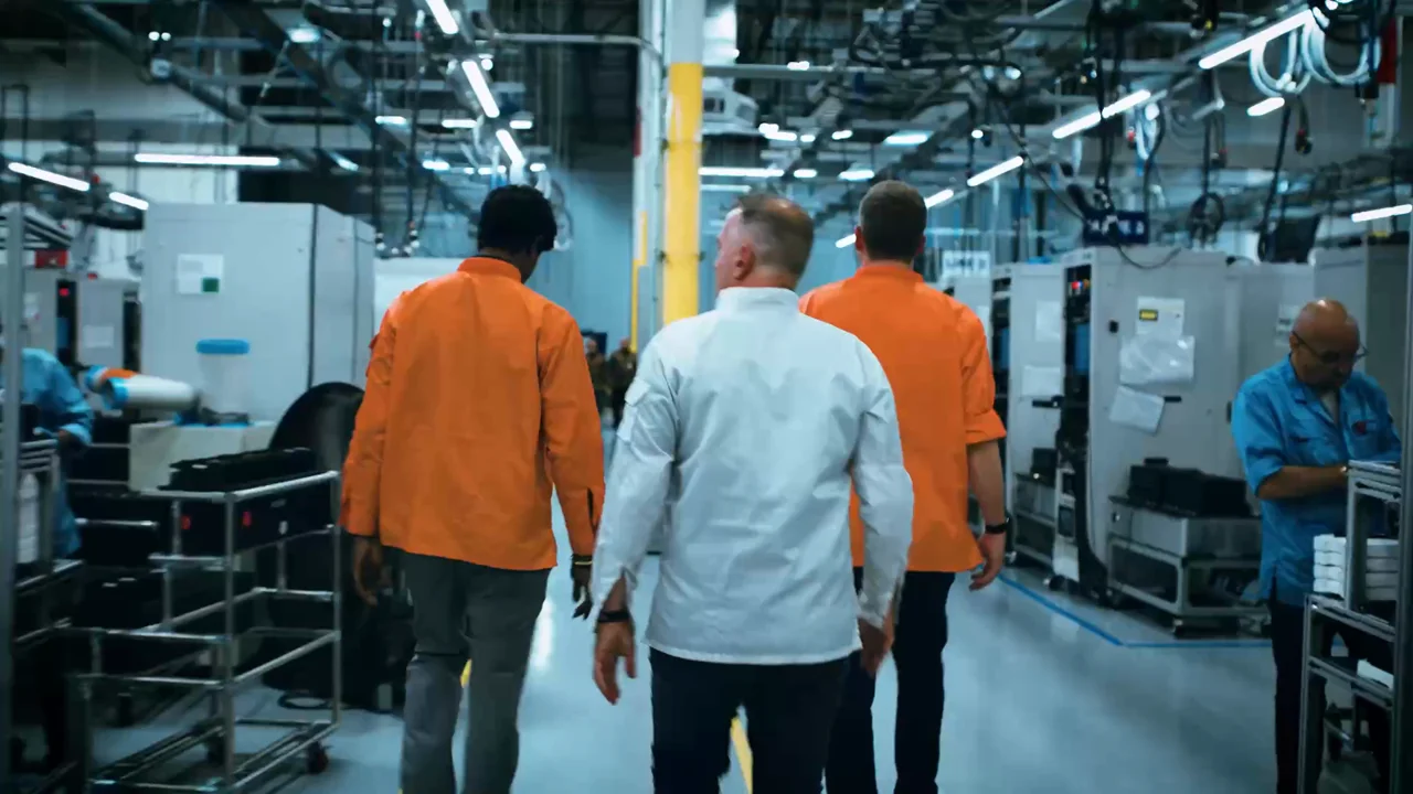 Enphase manufacturing team walking through the production facility