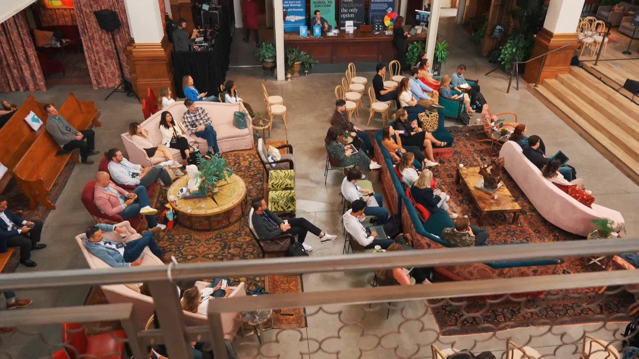 Overhead view of attendees watching a session at the UserGems event